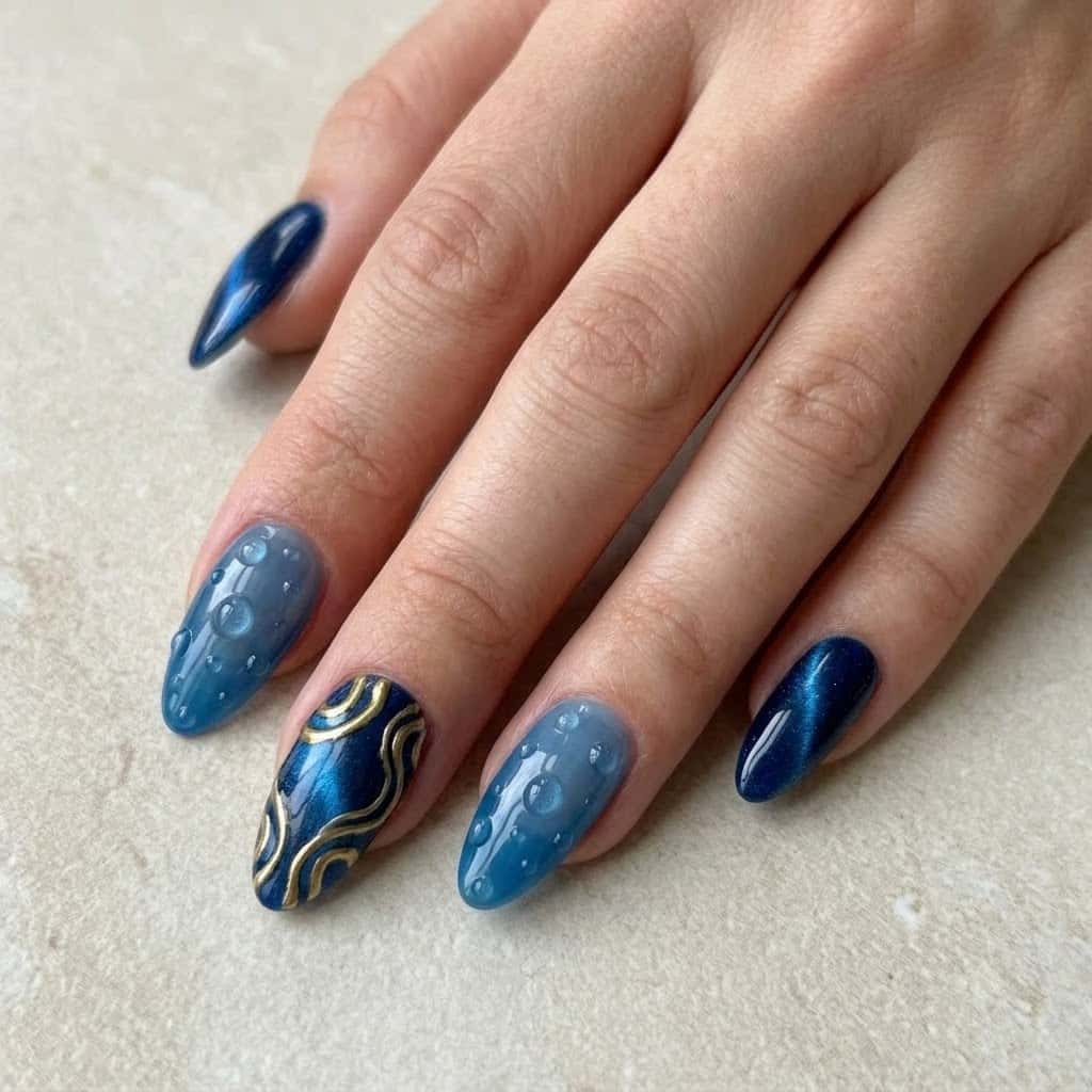 Hand wearing blue cat eye nails with the hero design on the middle finger