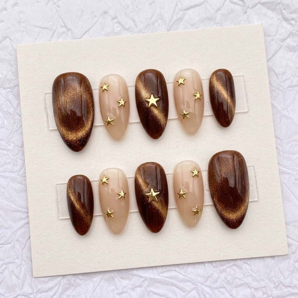 Brown cat eye nails, ten almond nails in two mirrored rows
