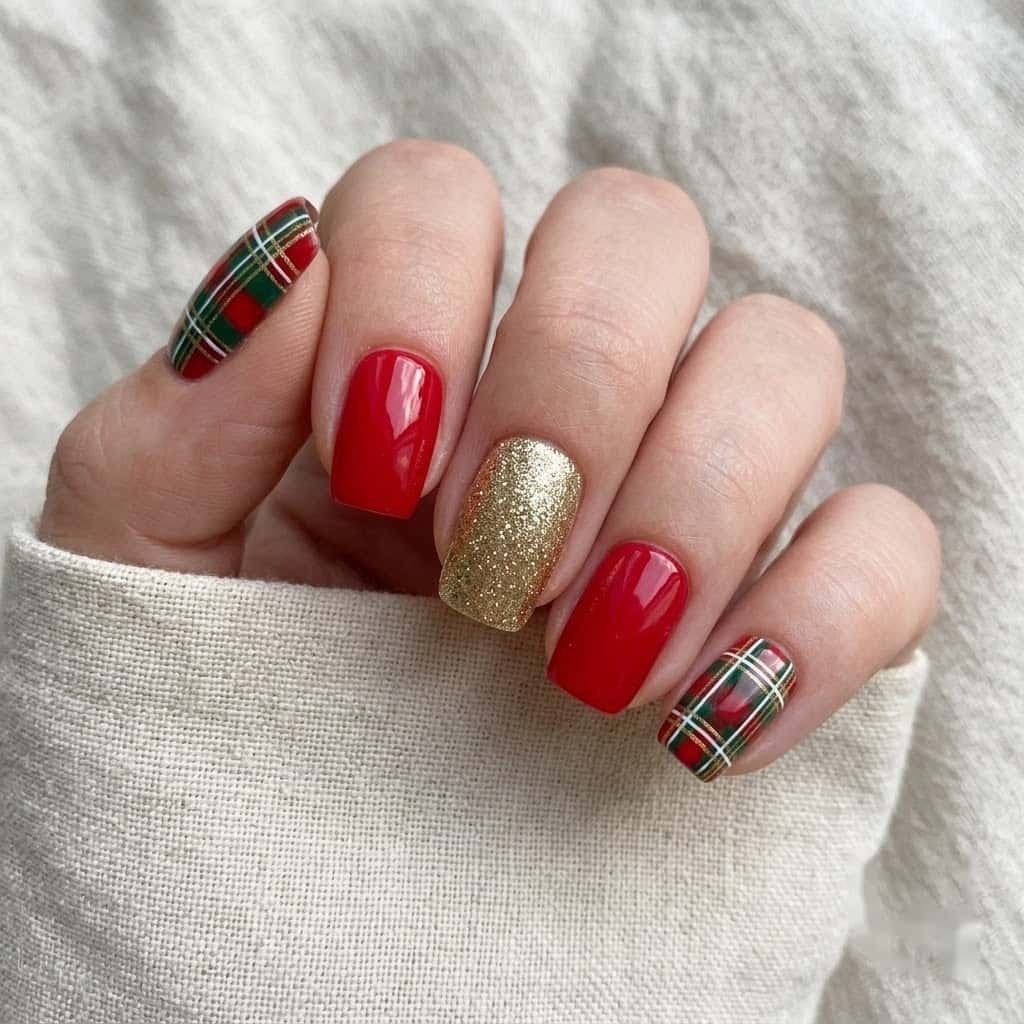 Hand wearing red and green christmas plaid press on nails