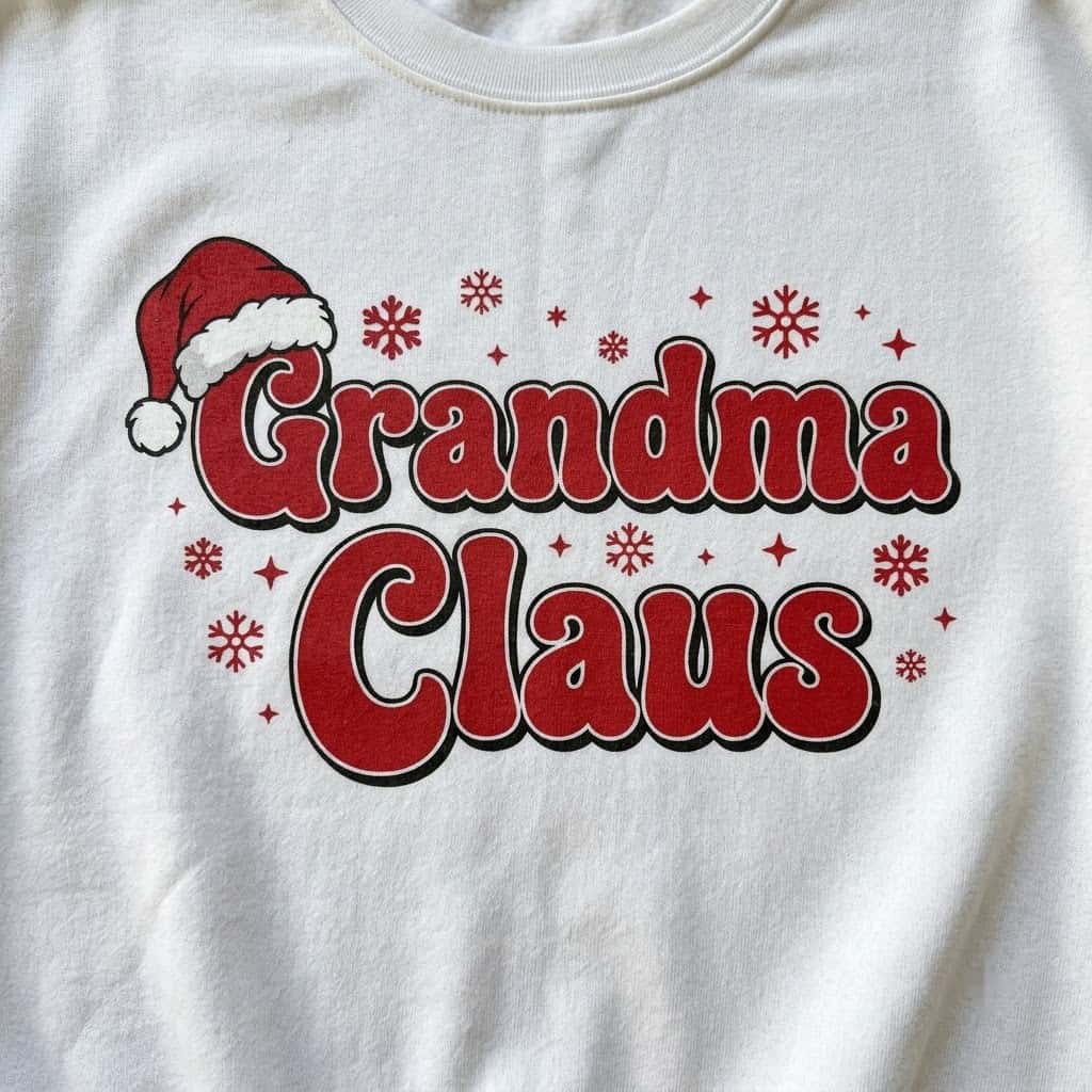 Close-up of the fluffy Santa hat on red bubble letters and snowflakes