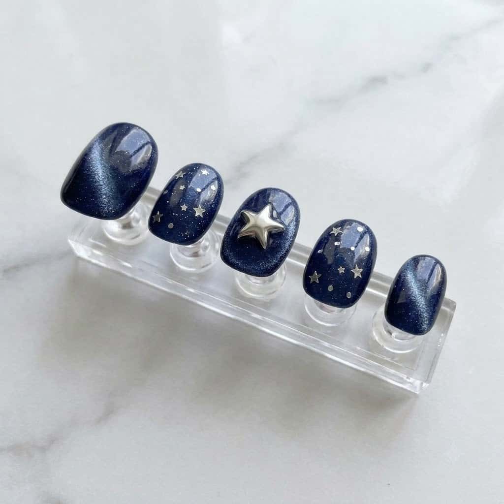 Five star dot nails on a clear acrylic stand