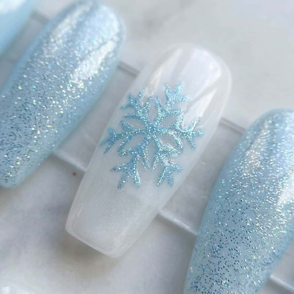 Close-up of a white snowflake with a crystal center