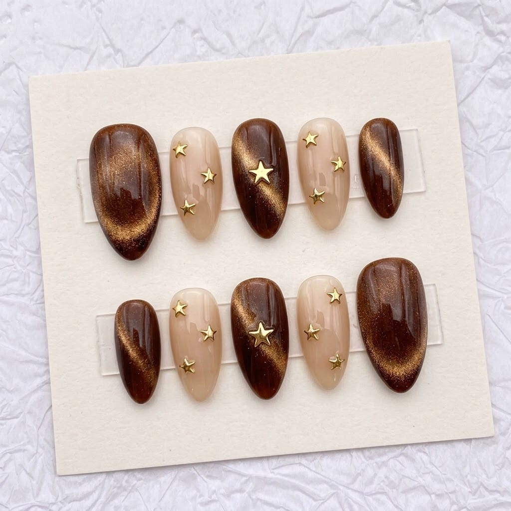 Brown cat eye nails, ten almond nails in two mirrored rows