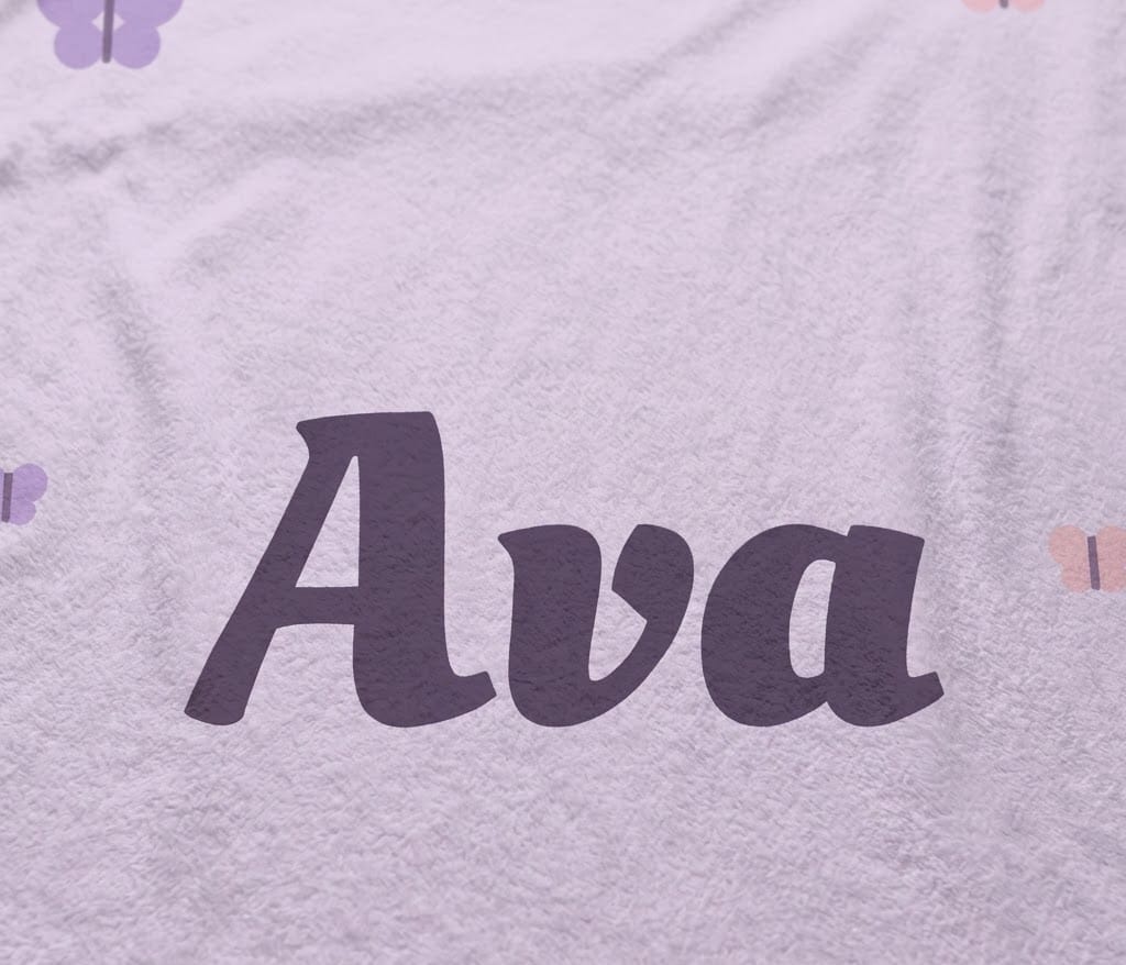 Detail view of the full plum Ava script on soft lavender flannel