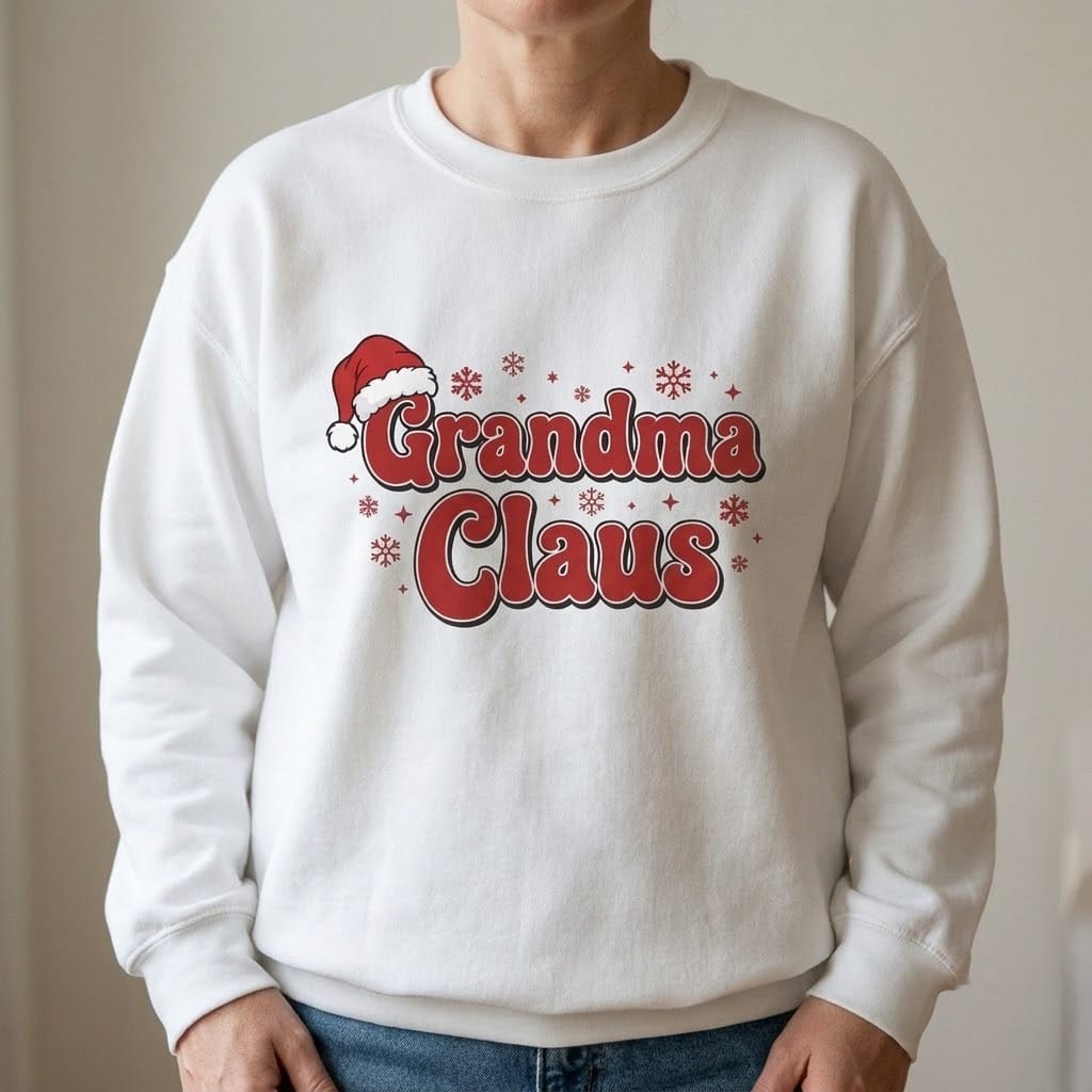 Person wearing a white crewneck with bold red Grandma Claus lettering