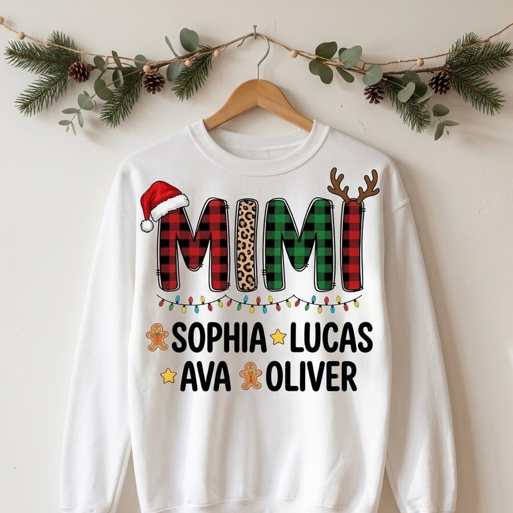Mimi Christmas crewneck with plaid letters on a wooden hanger under pine garland