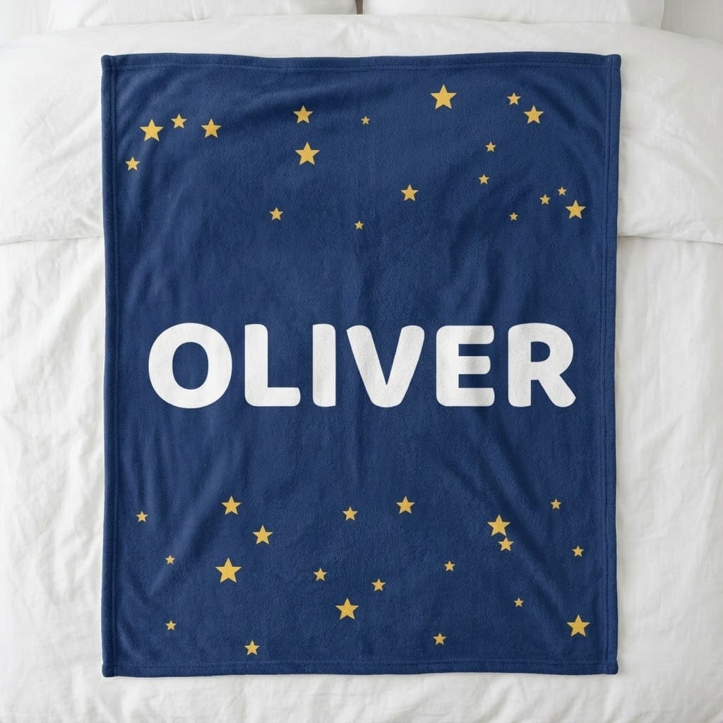 Personalized kids name blanket with big OLIVER name and gold stars on navy