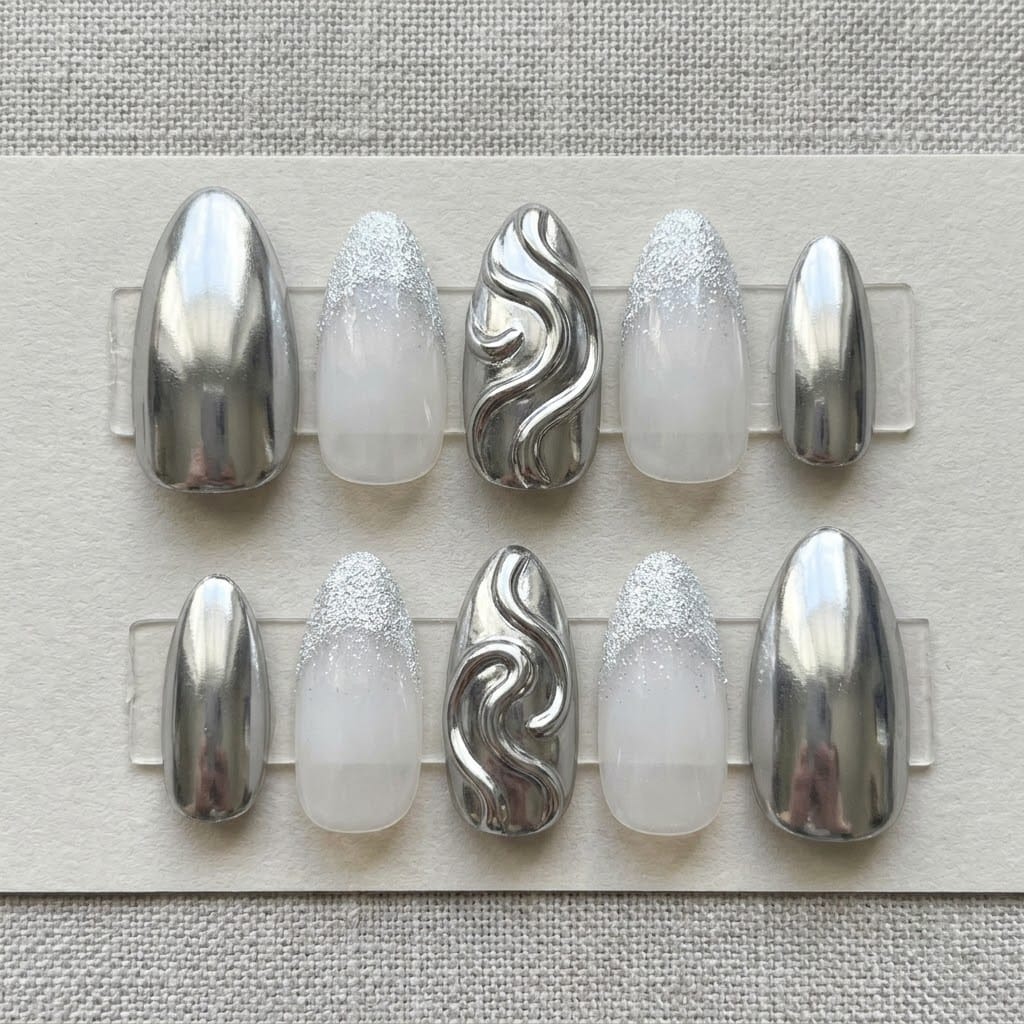 Silver chrome nails, ten almond nails in two mirrored rows