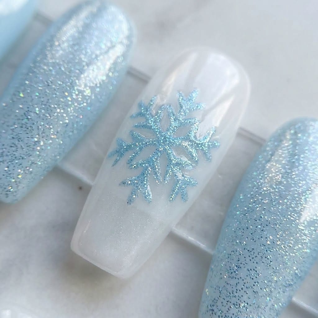 Close-up of a white snowflake with a crystal center