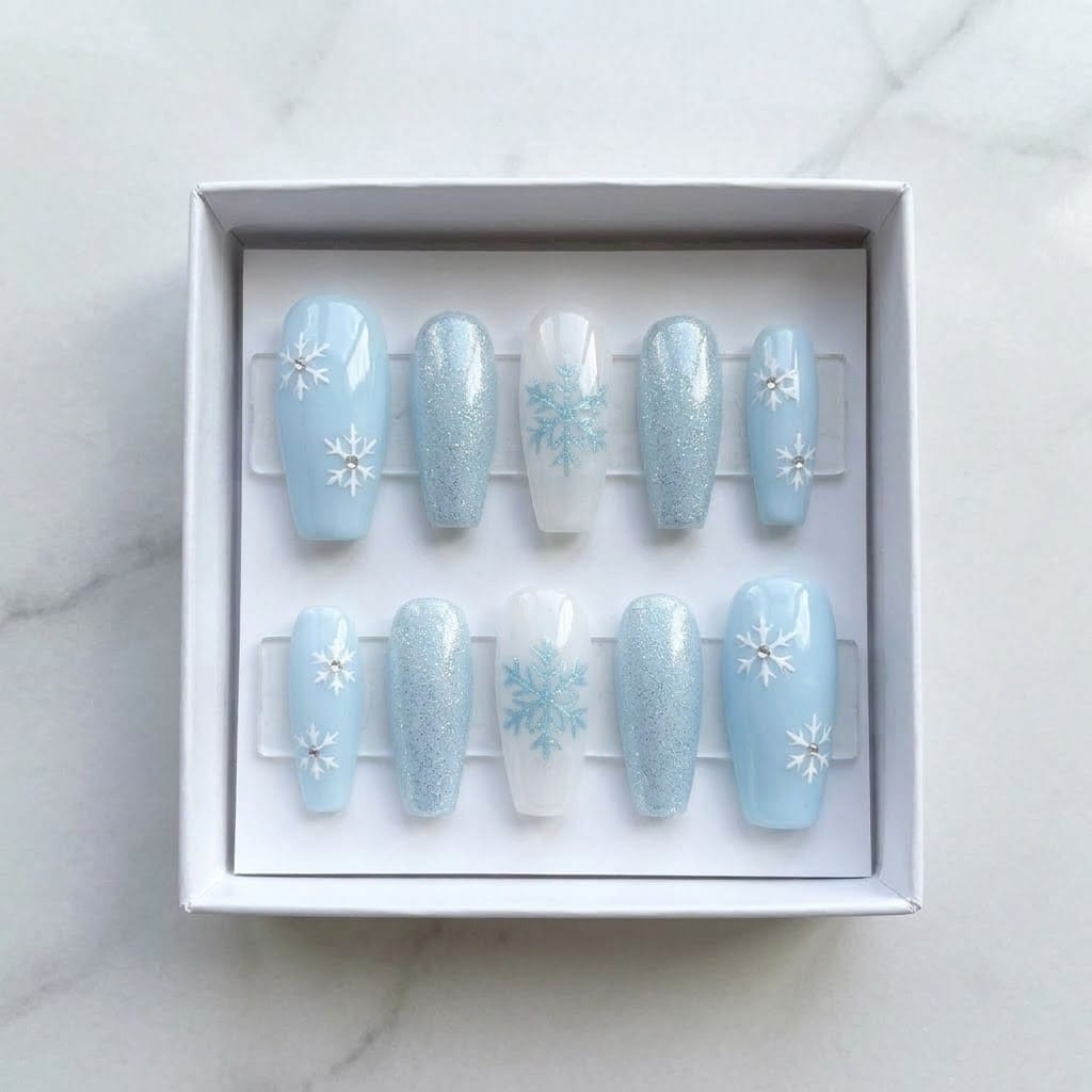 Icy blue snowflake press on nails set in a white gift box